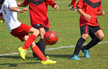 Young soccer players in action - Powered by Adobe