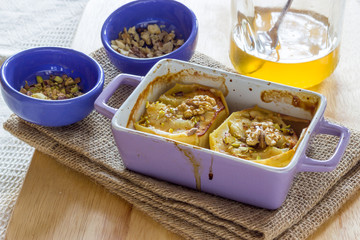 Baked apple with honey and pistachio nuts