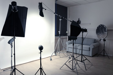 Empty photo studio with lighting equipment
