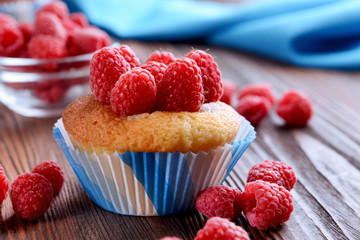Delicious cupcake with berries on table close up