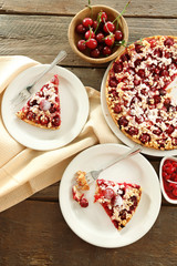 Tasty homemade pie with cherries on table close up