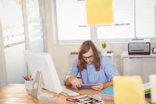 Creative businessman working on digital tablet