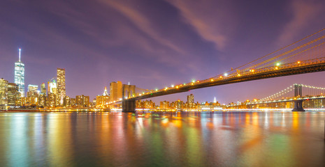 Long exposure of Brooklyn Bridge and downtown Manhattan skyline at night 