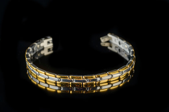 jewelry and bracelets on a black background

