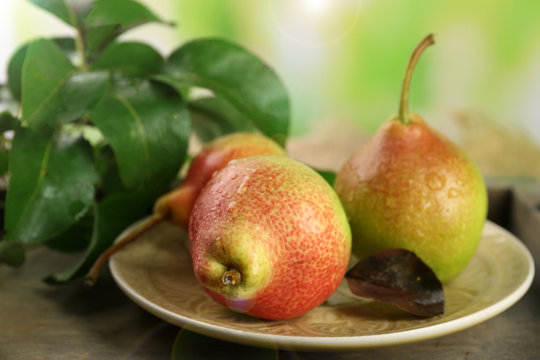 Fresh pears on wooden table, closeup