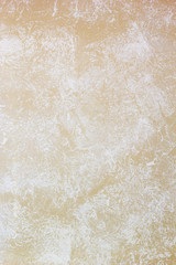 beige wall painted with textured paint roller