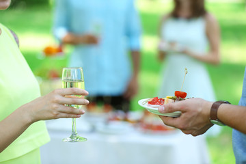 Guests drink champagne on wedding ceremony