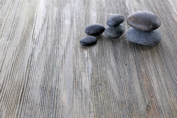 Spa stones on wooden background