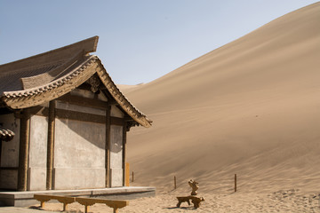 Chinese pavilion near sand dunes in desert, Dunhuang, China
