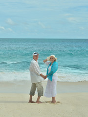 Elderly couple rest at tropical resort