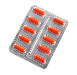 Capsules packed in blister isolated on white