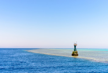 Marker at the edge of a mid ocean sand bank
