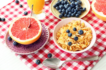 Healthy breakfast with fruits and berries on table close up