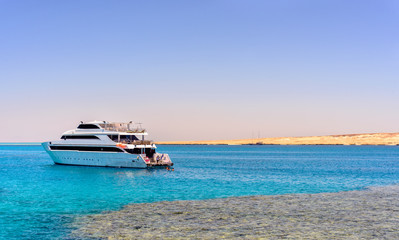 Pleasure boat or tour boat off a reef