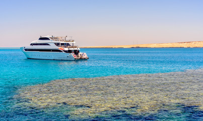 Pleasure boat or tour boat off a reef