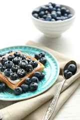 Still life with gourmet fresh blueberry tart