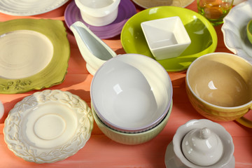 Different tableware on wooden table close up