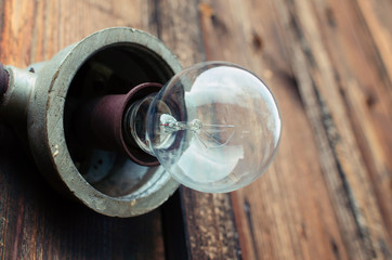 old outdoor bulb on wooden wall