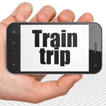 Tourism concept: Hand Holding Smartphone with Train Trip on