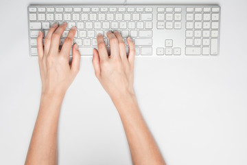 Hands working on the keyboard
