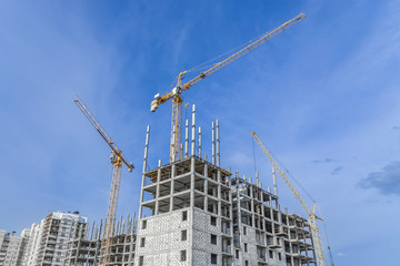 Fototapeta premium Construction landscape and lifting crane