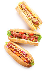 Three fresh hot dogs isolated on white