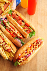 Fresh hot dogs on wooden background
