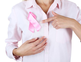 Woman using pink ribbon on her chest isolated on white