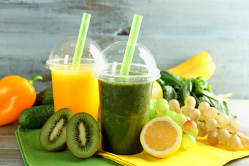 Fresh juice mix fruit, healthy drinks on wooden table, on bright background