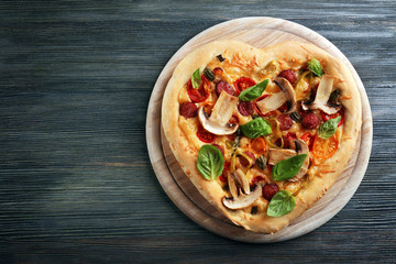 Heart shaped pizza on cutting board isolated on white