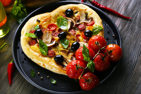 Heart Shaped Pizza On Metal Tray On Wooden Table