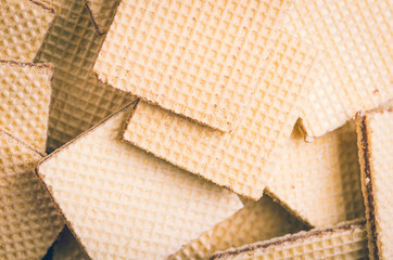 Closeup of piled up crispy tasty square cookies