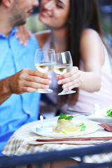 Young couple in street cafe
