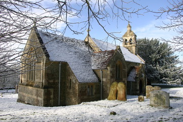 Church surrounded by snow in a winter scene