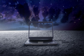 Big laptop on the outer space