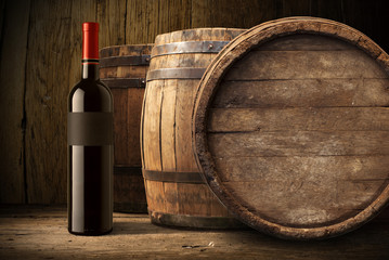 wine bottle and wooden barrel