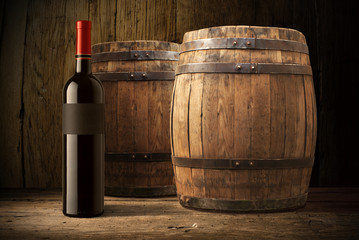 wine bottle and wooden barrel