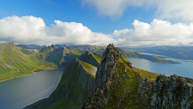 Senja island, Norway. Landscape with mountains, fjord and clouds. Time lapse.