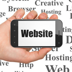 Web design concept: Hand Holding Smartphone with Website on