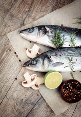 Raw seabass fish on the wooden board