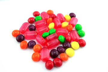a lot of colorful candies on a white background

