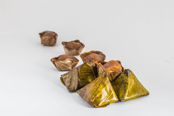 Dessert wrapped in banana leaves