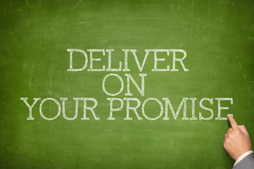 Obraz premium Deliver on your promise text on blackboard