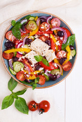Greek salad with fresh vegetables, feta cheese, black olives