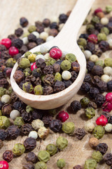 Color pepper on a wooden background.