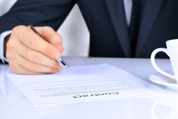 Businessman is signing a contract, business contract details