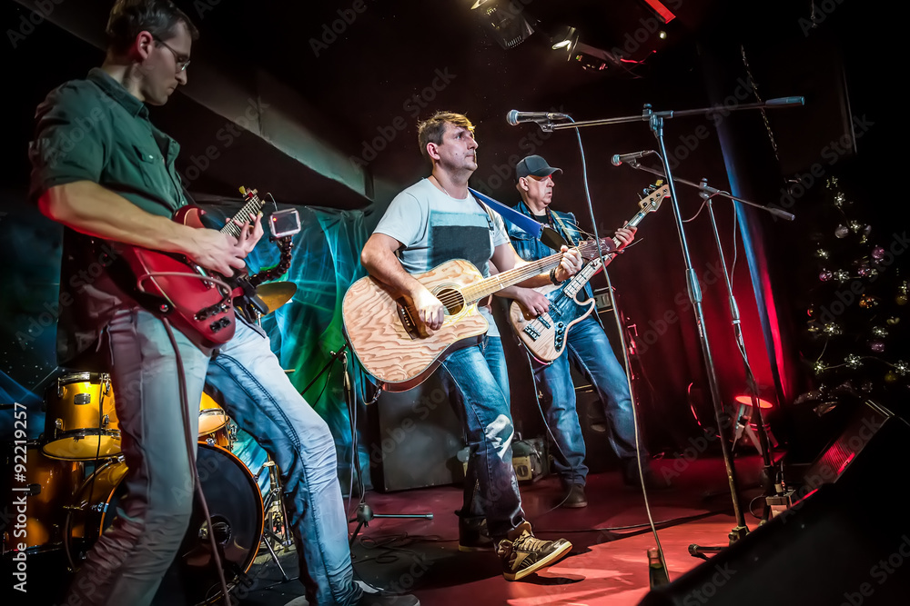 Wall mural band performs on stage