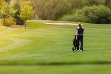 Golf player on green lawn