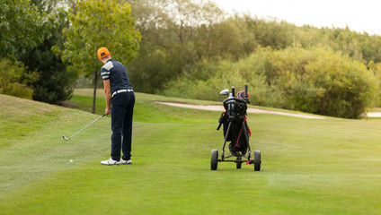Golf player with club