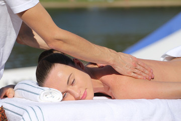 Caucasian woman lying on a massage table